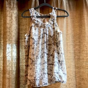 Dressy sleeveless top with fabric flowers at neck